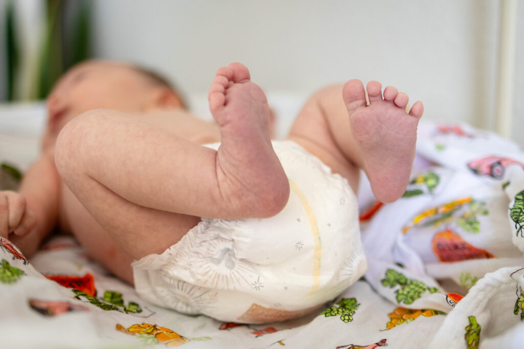 Detail of newborn’s feet captured during a Newborn Lifestyle Photography session in San Francisco.