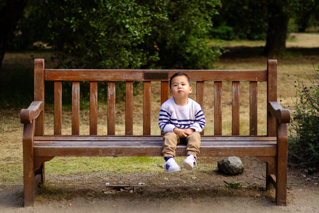 arizona cactus garden family photographer candid toddler sitting on bench
