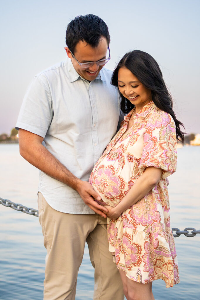 Maternity Photography Poses - ellobelle photography: Couple looks down smiling at baby bump together