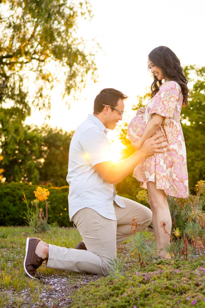 Maternity Photography Poses – ellobelle photography: Partner smiling at baby bump with hands resting on belly