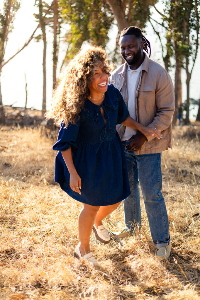 Parents laughing together outdoors at Coyote Point – Ellobelle Photography