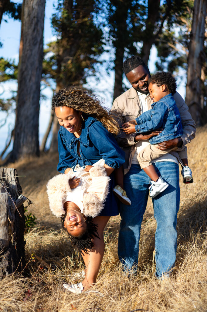 Family laughing and playing together at Coyote Point – Ellobelle Photography