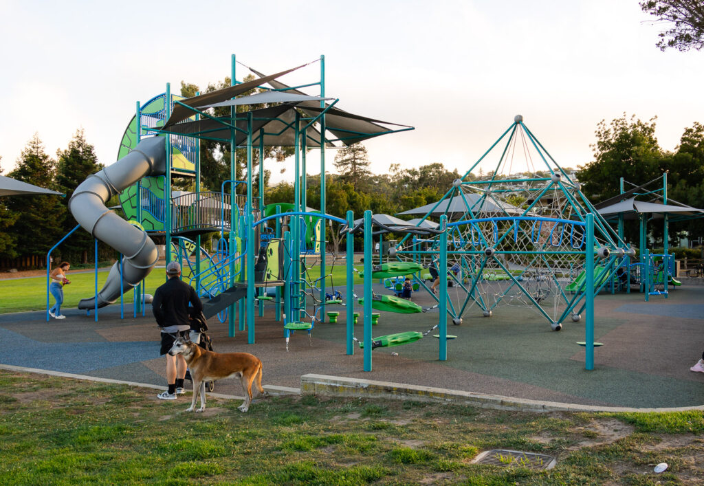 Modern playground with twisty slide and climbing structures at Central Park Millbrae – Ellobelle Photography