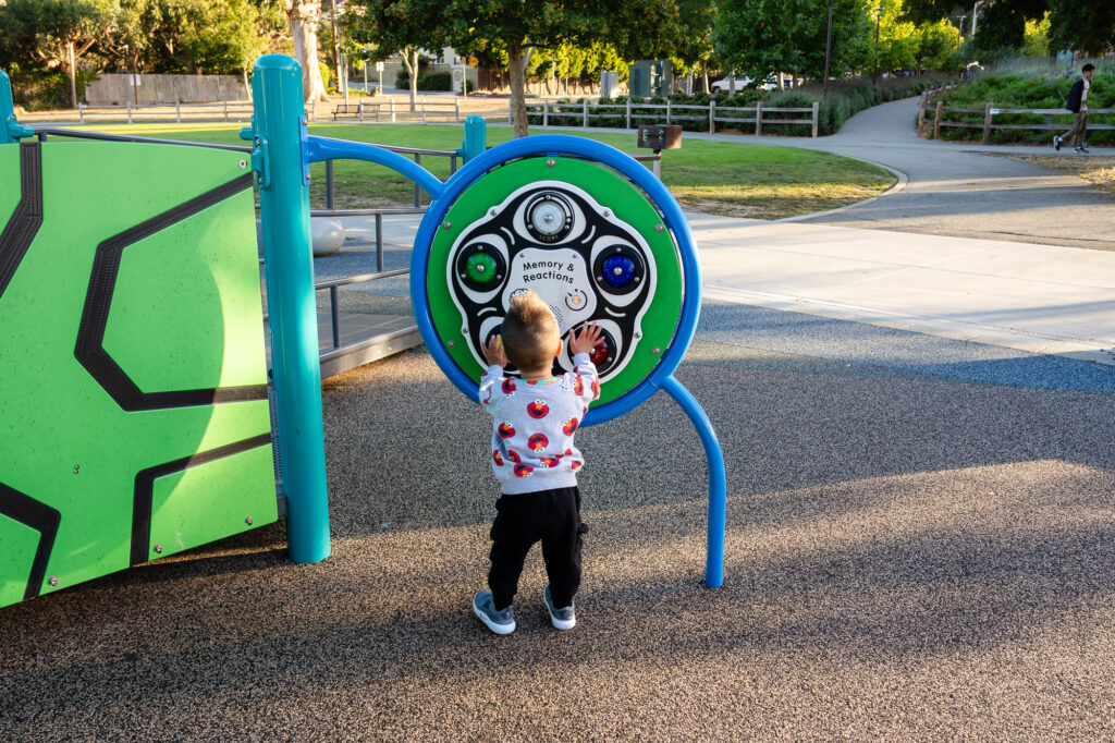 Toddler playing memory game at Millbrae Central Park interactive playground – Ellobelle Photography