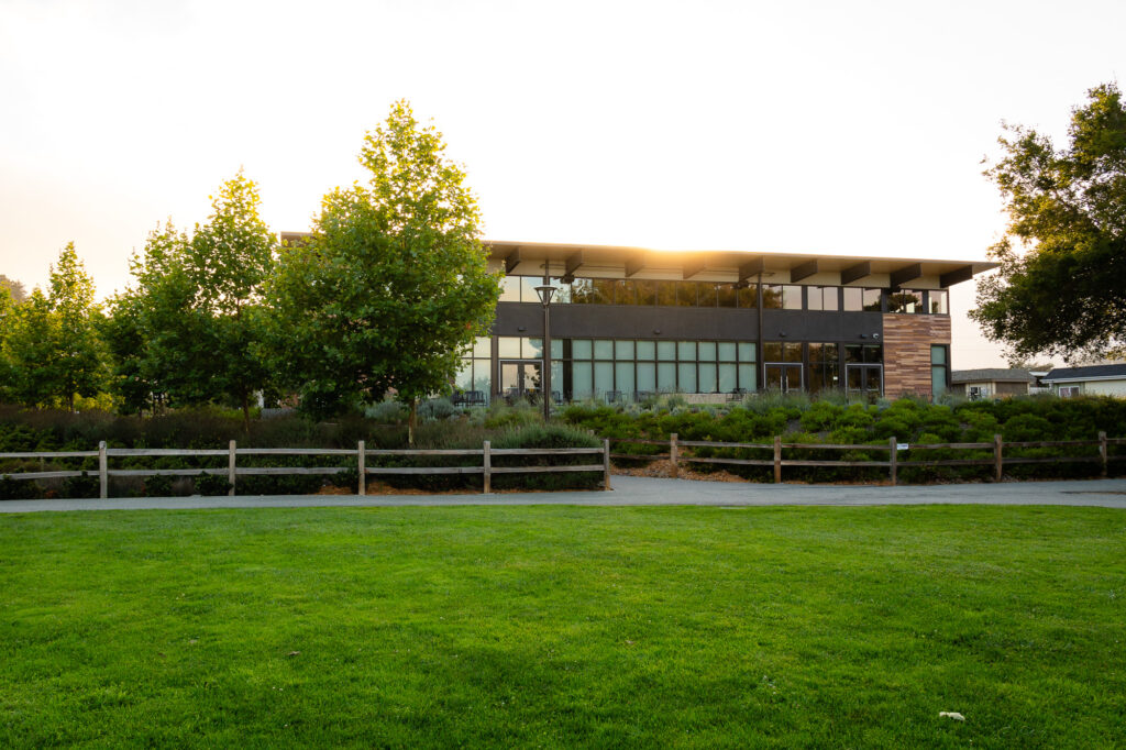 Millbrae Recreation Center at Central Park building at sunset behind green lawn – Ellobelle Photography