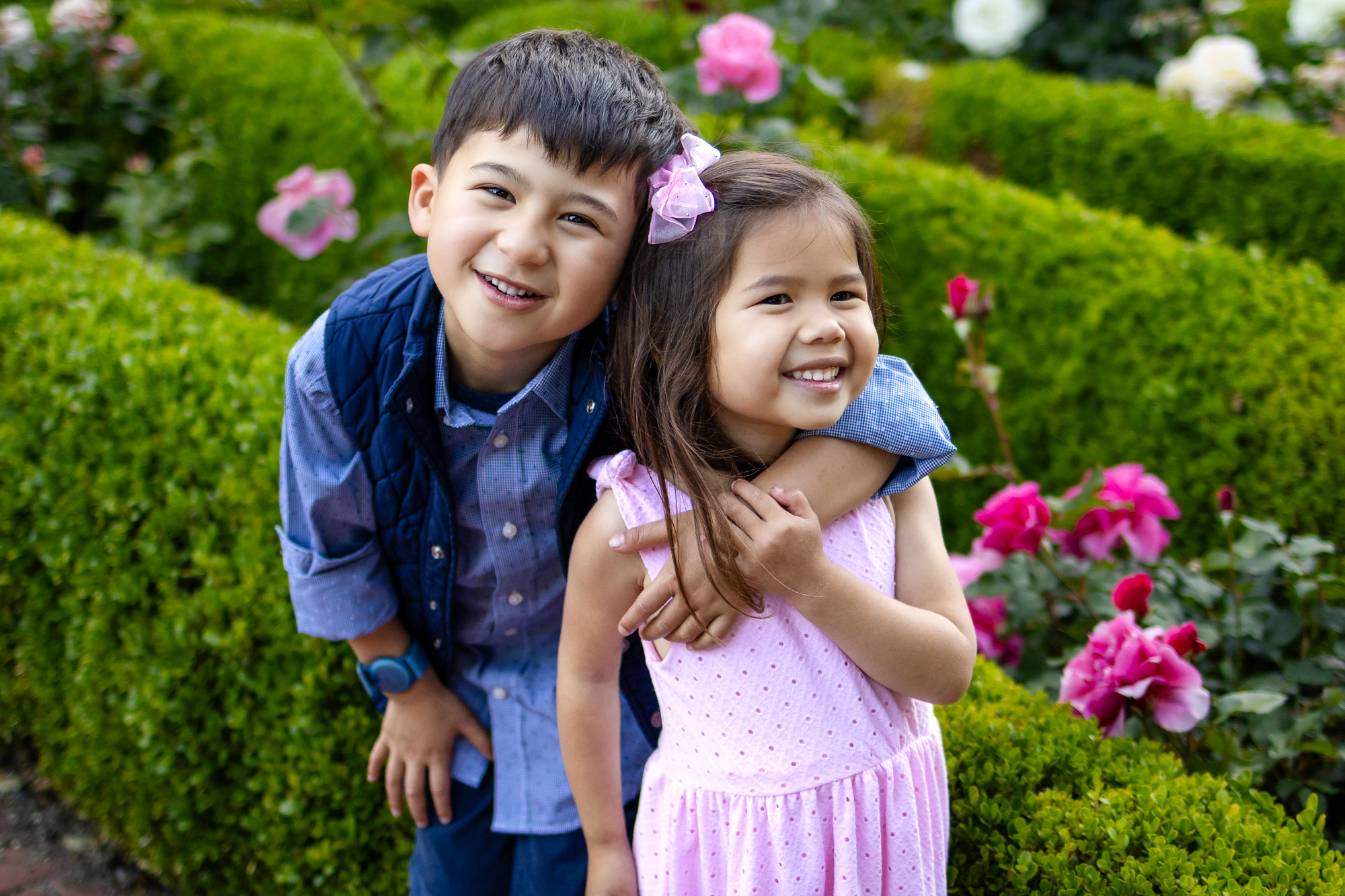 Brother hugging sister in rose garden at Kolh Mansion Burlingame – Ellobelle Photography