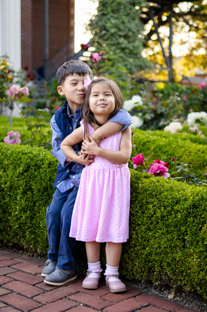 Big brother kissing little sister’s head during Kolh Mansion photos in Burlingame – Ellobelle Photography