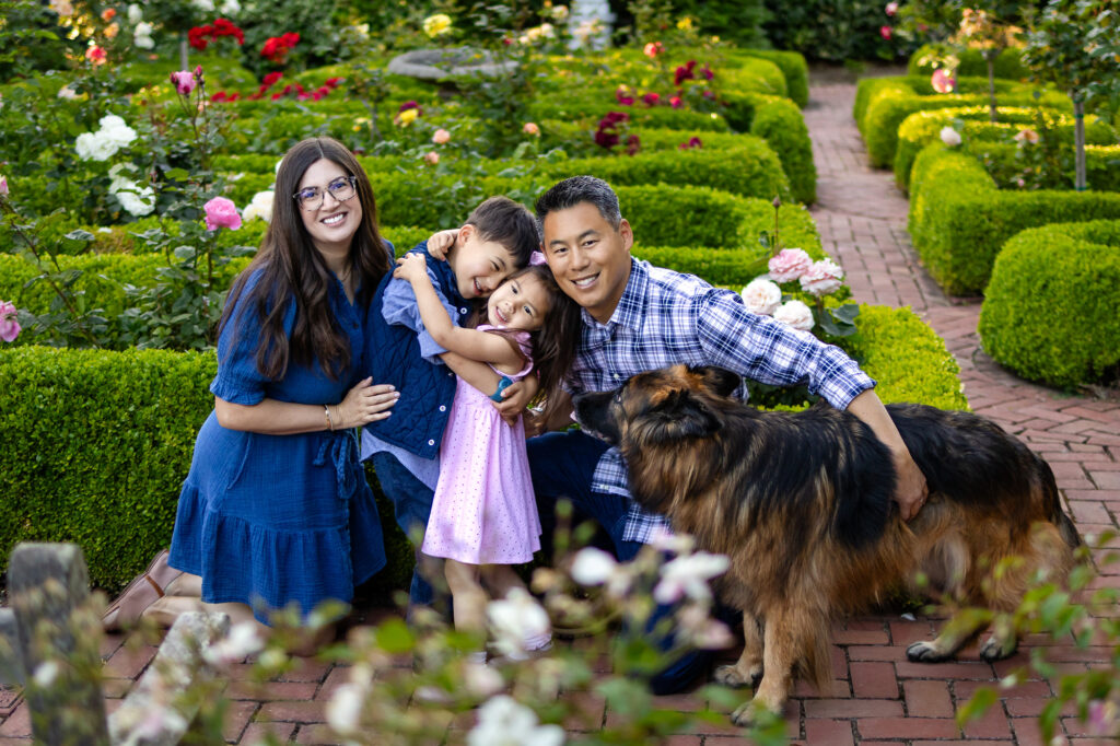 Parents and kids smiling with dog in rose garden at Kolh Mansion Burlingame – Ellobelle Photography