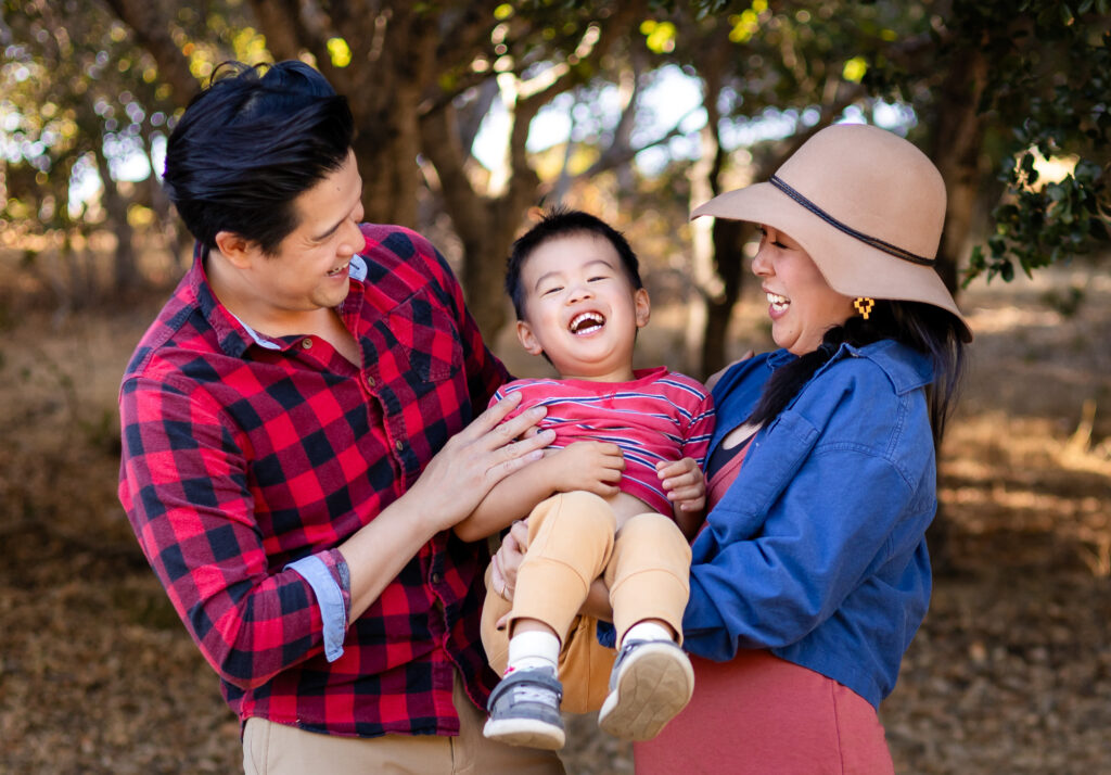 Family smiling together during playful moments