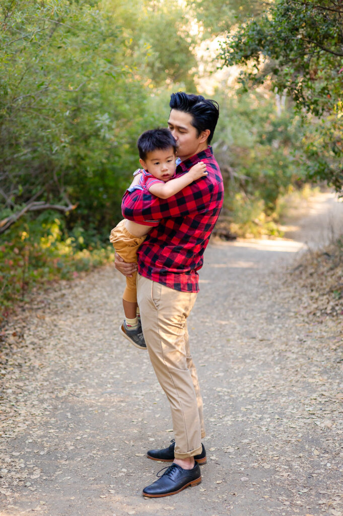 Father hugging child on peaceful pathway at Laurelwood