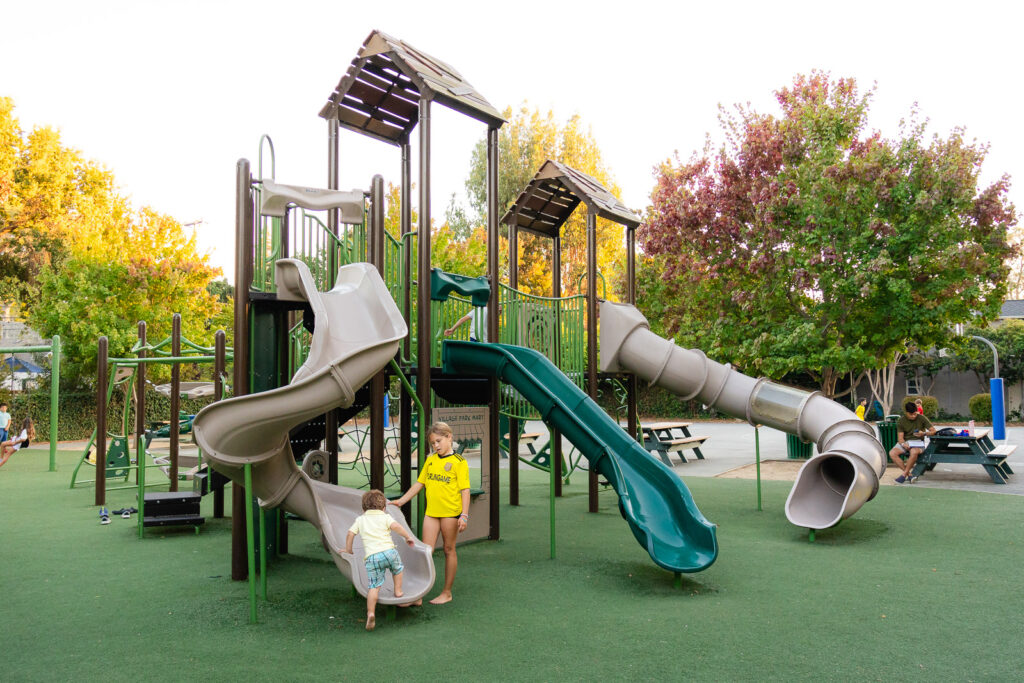Children playing on slides at Village Park Playground in Burlingame – Ellobelle Photography