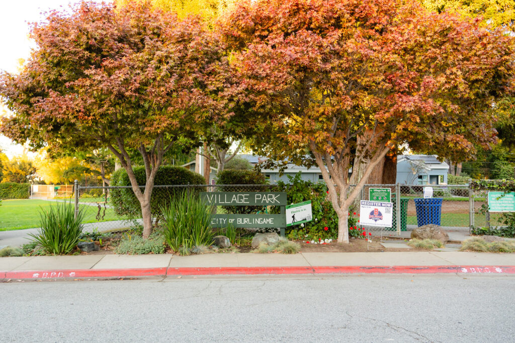 Fall foliage over Village Park Burlingame sign – Ellobelle Photography