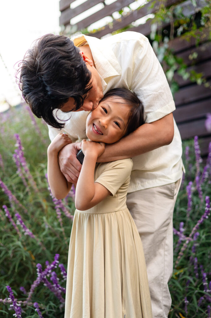 Dad kissing daughter’s cheek during family photos at Washington Park Burlingame – Ellobelle Photography