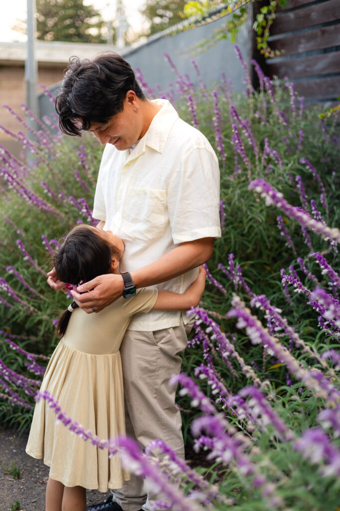 Daughter hugging her dad in the garden path at Washington Park Burlingame – Ellobelle Photography