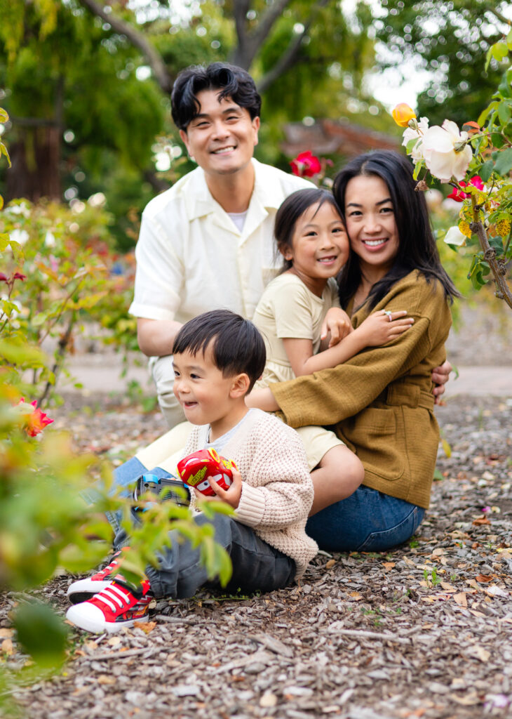 Family of four sitting in rose garden at Washington Park Burlingame – Ellobelle Photography