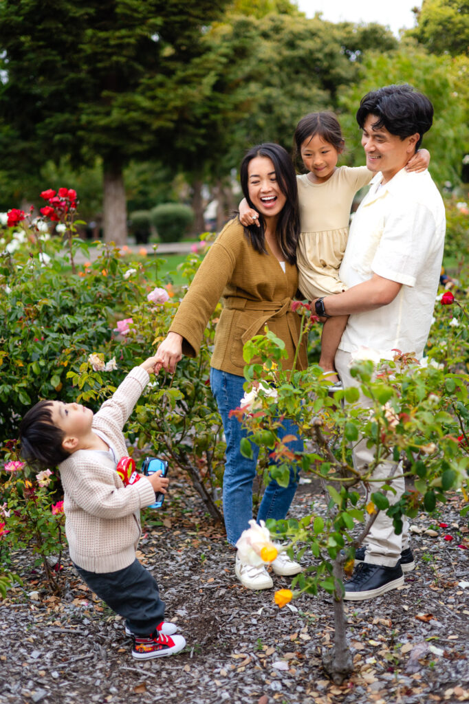 Family laughing together in rose garden at Washington Park Burlingame – Ellobelle Photography