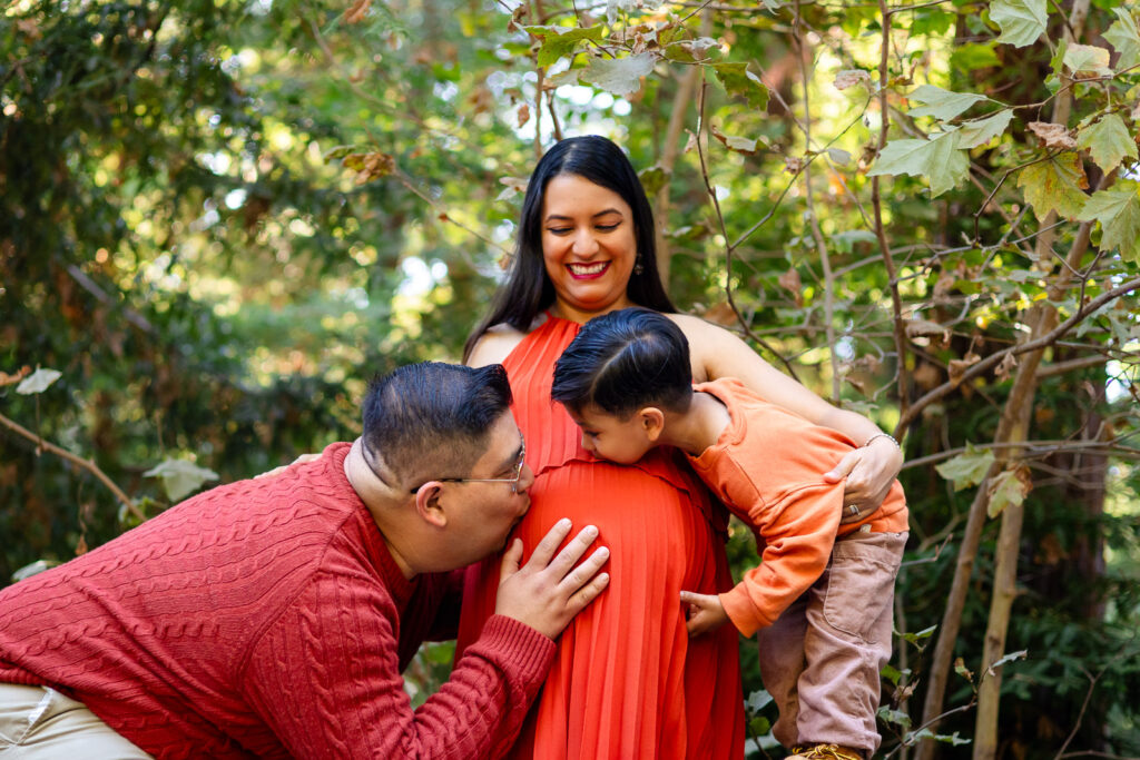 Dad and son kissing pregnant belly in joyful Bay Area maternity session – Ellobelle Photography