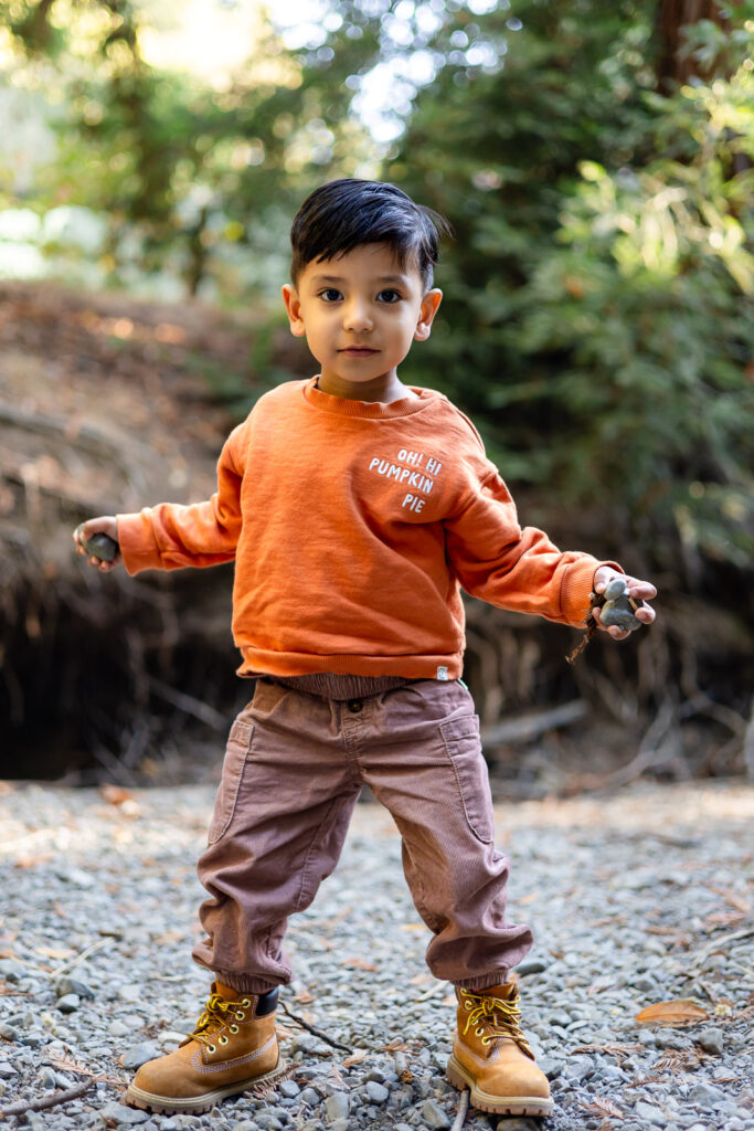 Little boy holding rocks during outdoor Bay Area maternity session – Ellobelle Photography