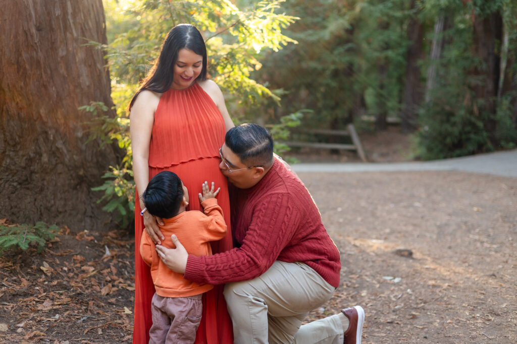 Big brother and dad touching baby bump during Bay Area maternity session – Ellobelle Photography