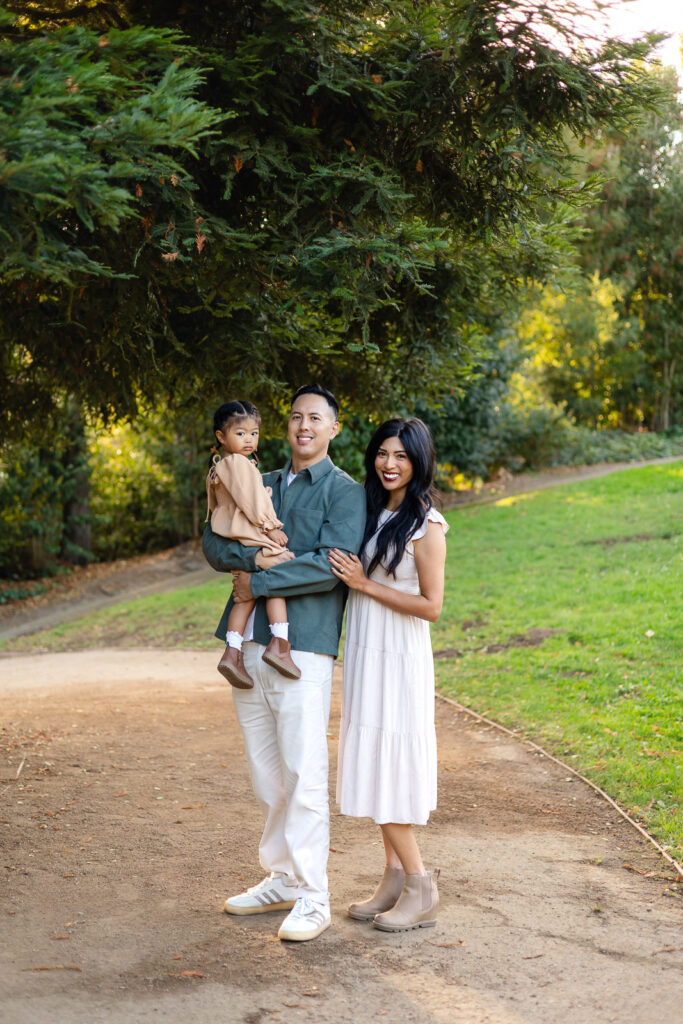 Family standing together on a forest trail during holiday photo sessions – Ellobelle Photography