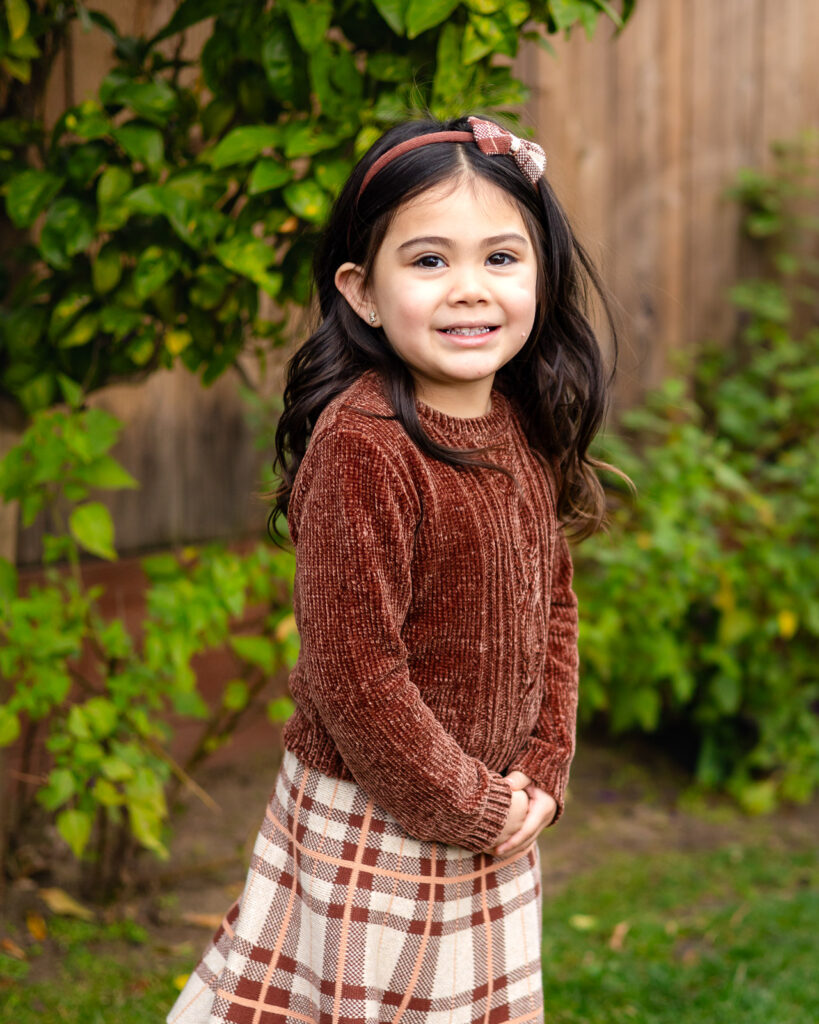 Outdoor student portrait with natural greenery of school photographer