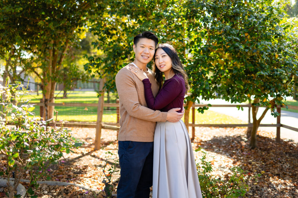 Couple embracing in a garden setting for making the most of your family photo session