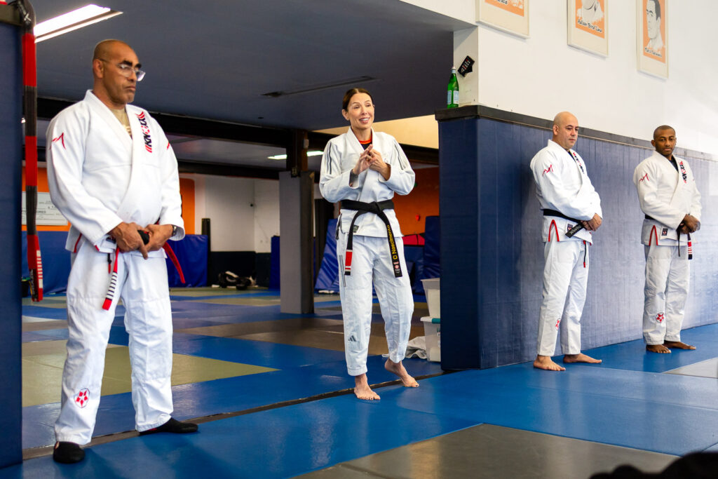 Marco Nascimento instructors speaking during a San Mateo Bay Area class ceremony at the academy