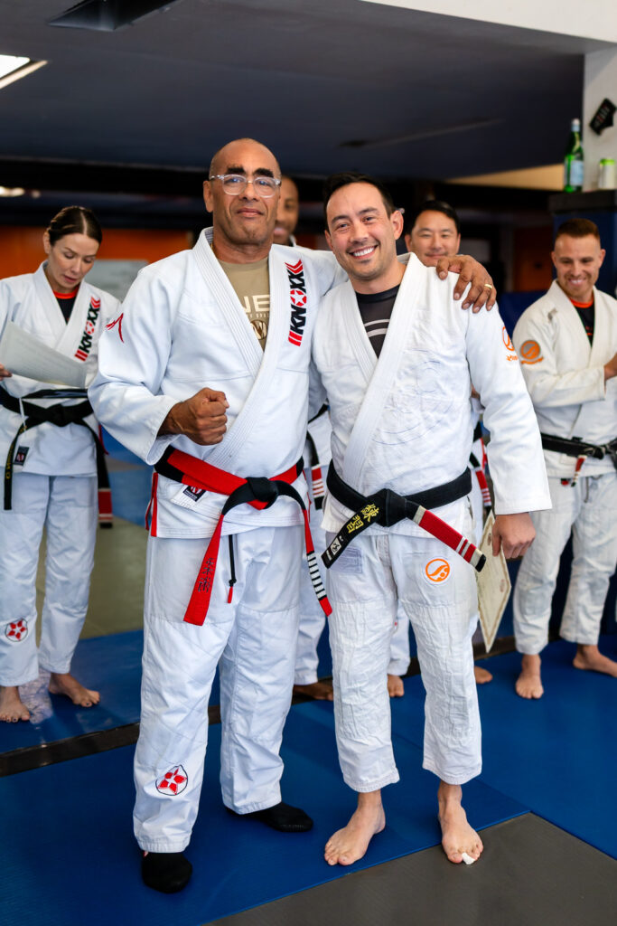 Martial arts training for families in San Mateo with a student during a promotion