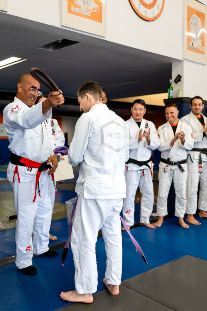 Marco Nascimento awarding a new belt rank during a Brazilian jiu jitsu
ceremony