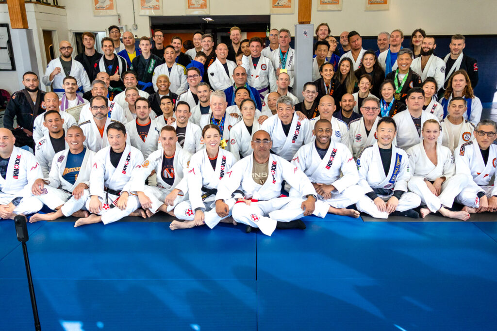 Large group photo of Jiu Jitsu students and instructors