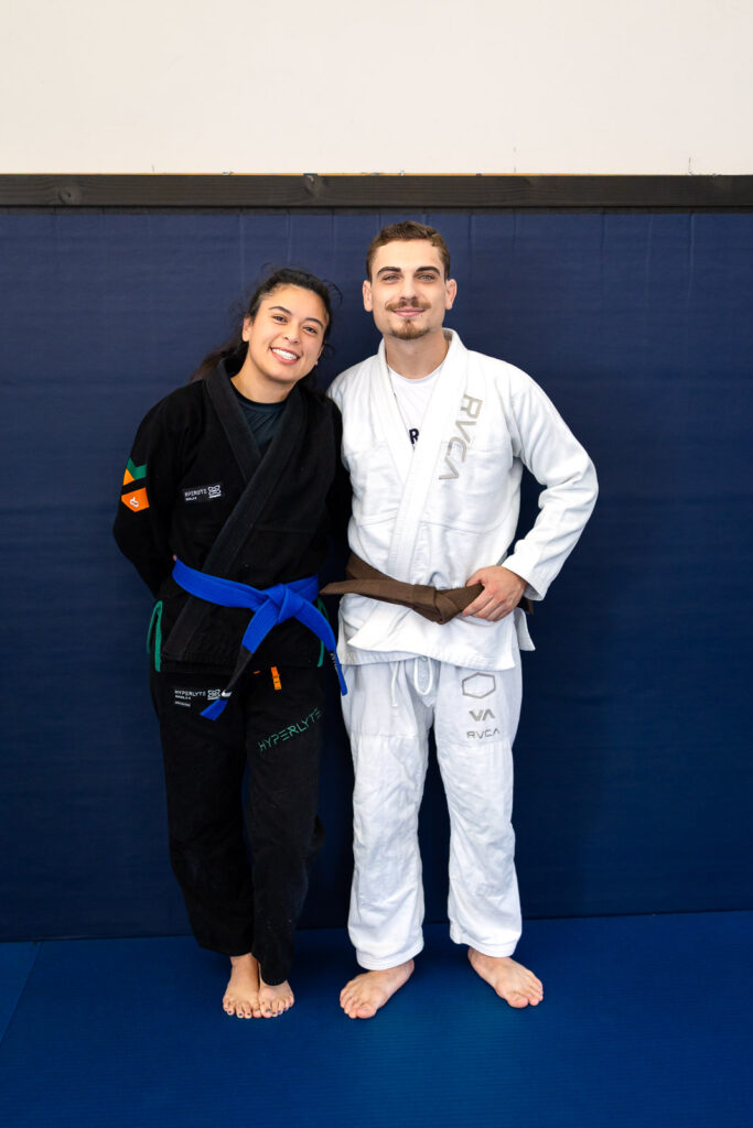 Two students posing together at Marco Nascimento BJJ gym