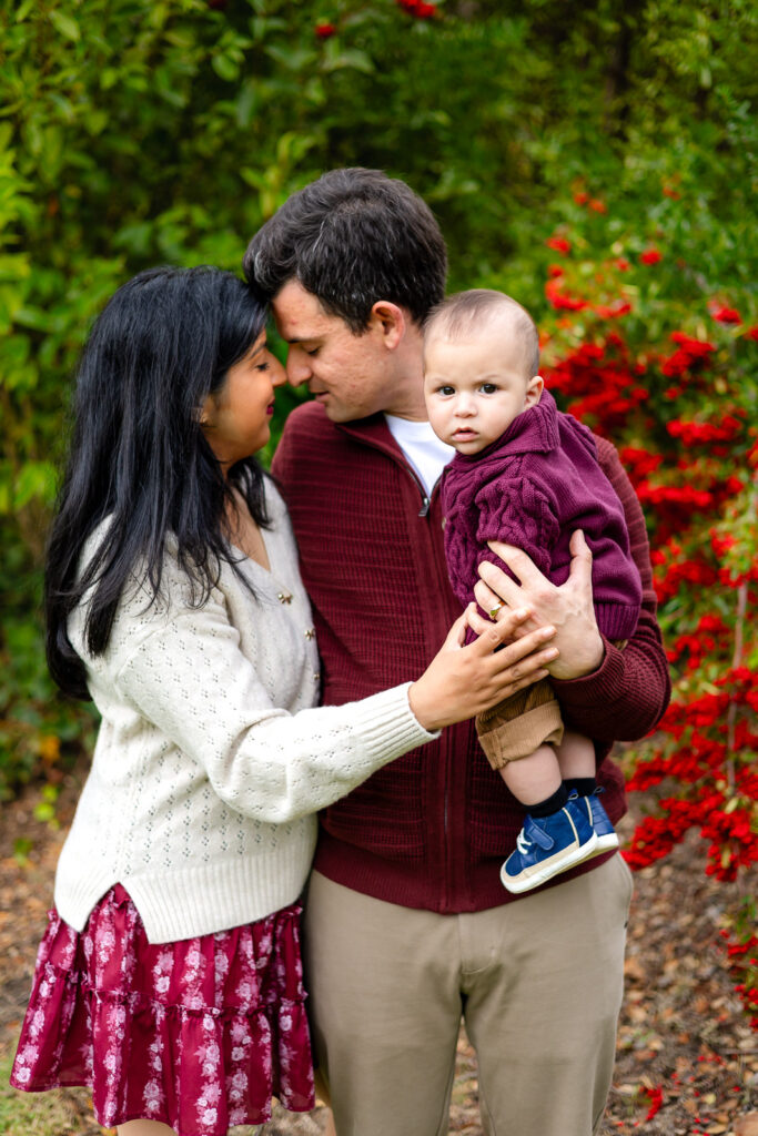 Parents holding their baby during a sweet moment at Millbrae Meadows Park Millbrae Bay Area