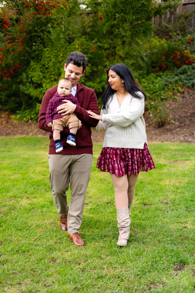 Family walking through the grass at Millbrae Meadows Park San Mateo County Bay Area