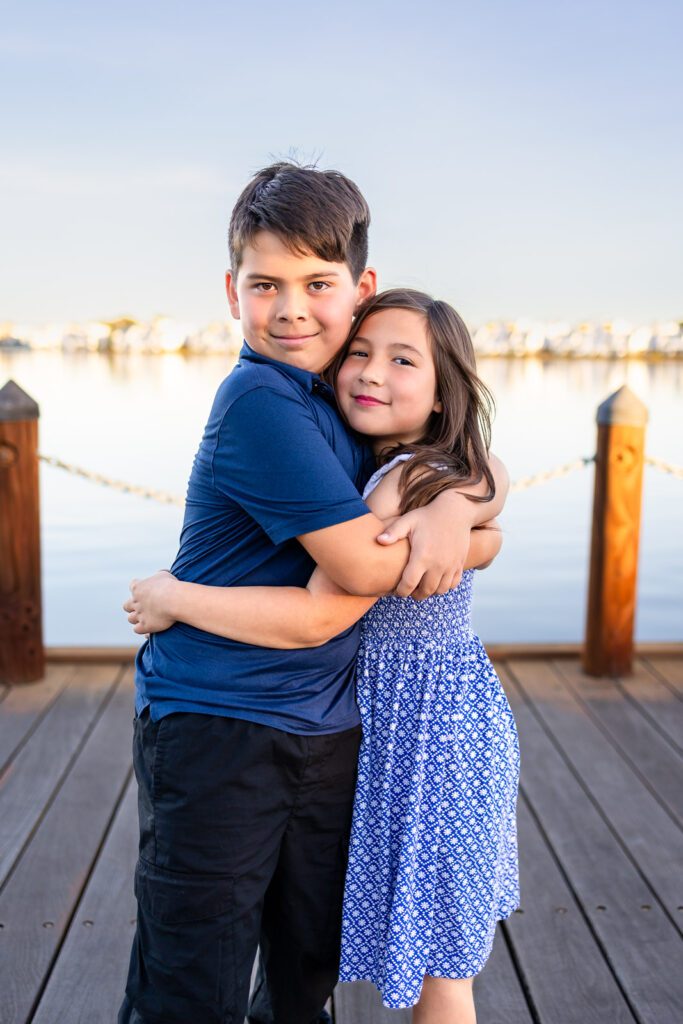 Siblings smiling together for a portrait