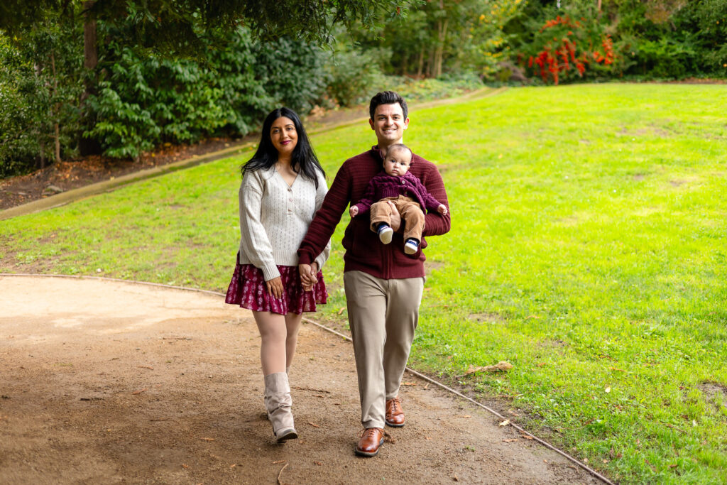 Family walking together on a garden path