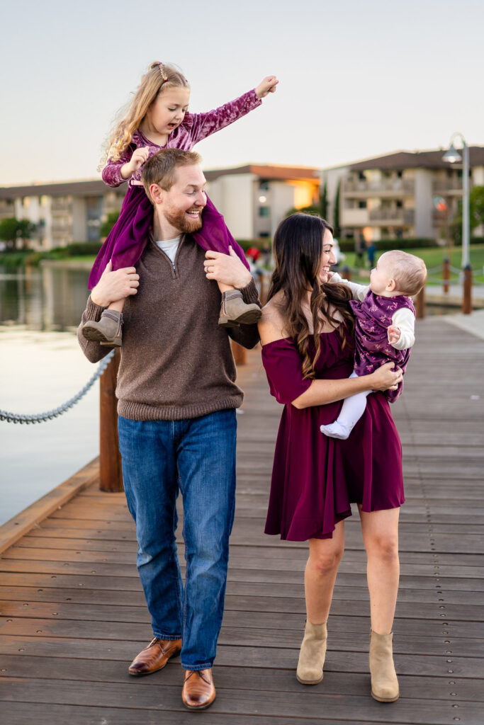 Family walking together on a lakeside boardwalk at a Burlingame park for a helpful items for a stress free session overview