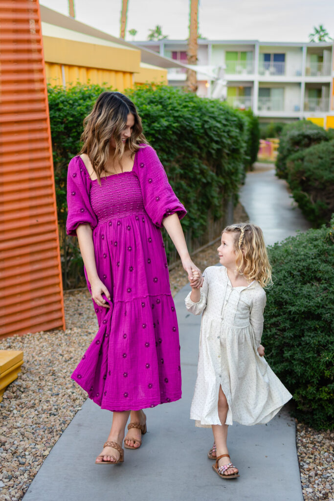 Mother and daughter running together during mommy and me photos Peninsula playful outdoor portrait