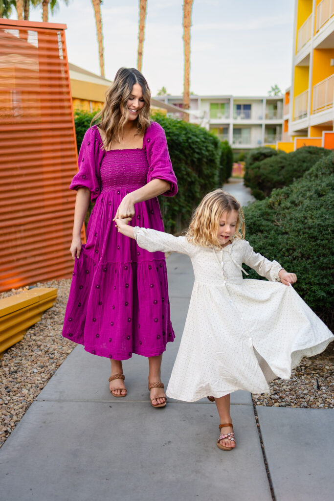 Mother walking with daughter during motherhood session by Burlingame mommy and me photographer lifestyle portrait