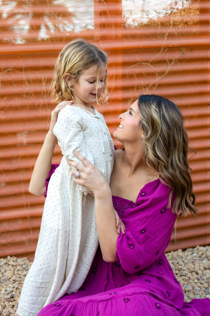 Mother kissing daughter on the nose during mommy and me photos Peninsula tender lifestyle motherhood moment