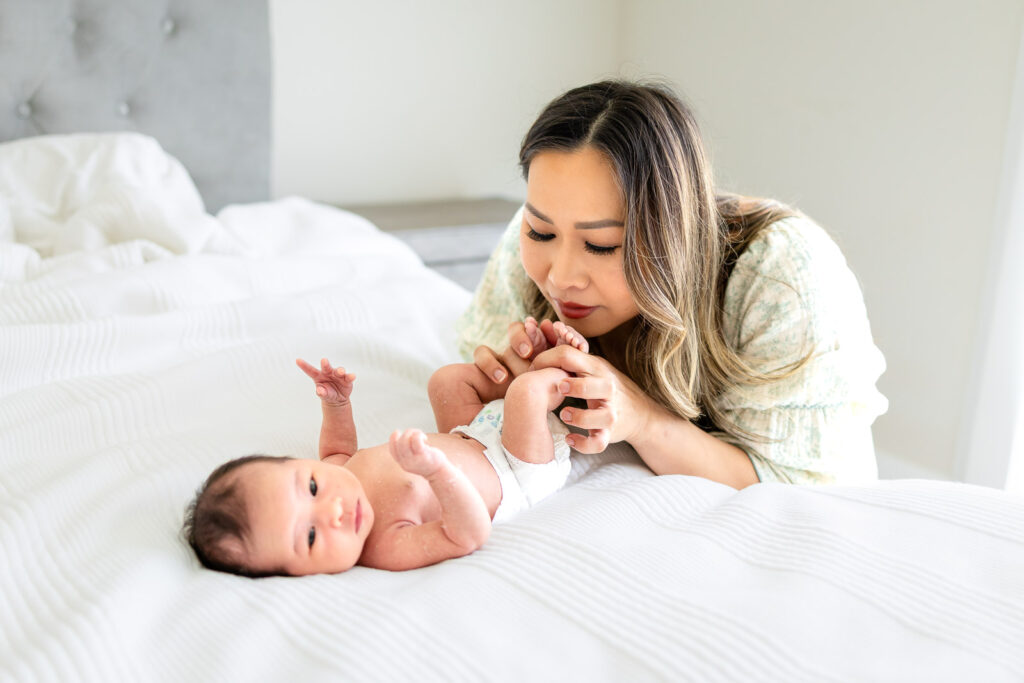 A detailed close-up of a sleeping newborn baby's face, focusing on the small, fleeting features that parents want to remember forever, taken during a calm in-home session in San Mateo County.