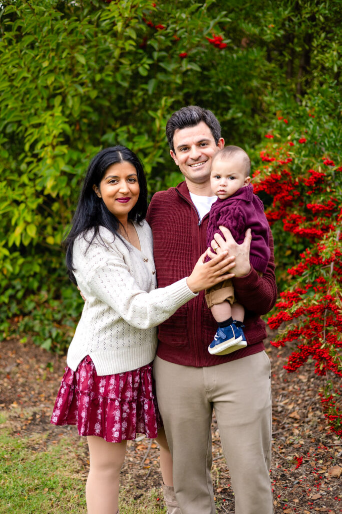 A family with newborn baby hugging during a Bay Area photographer mini session, showcasing quick and joyful connections.