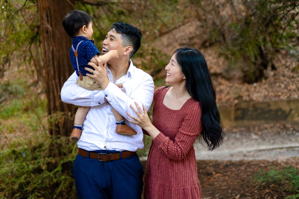 A cozy family portrait taken in a redwood forest during a fall session.