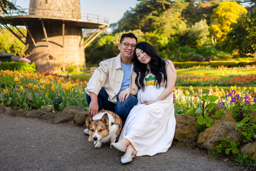 A family sitting among the flowers at Queen Wilhelmina Garden with a San Francisco family photographer.