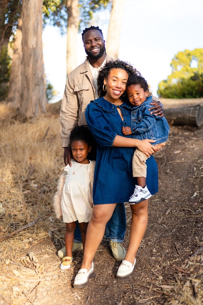 Family wearing denim and cream tones during an outdoor family photography session