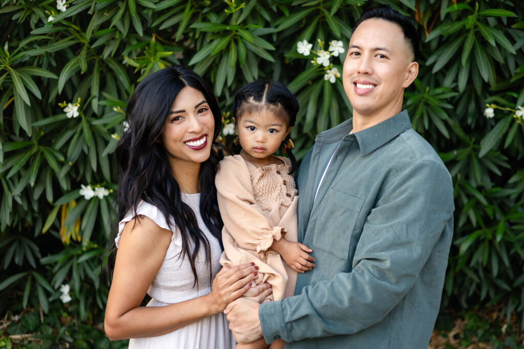 Family walking through a park during family holiday photography in San Mateo County