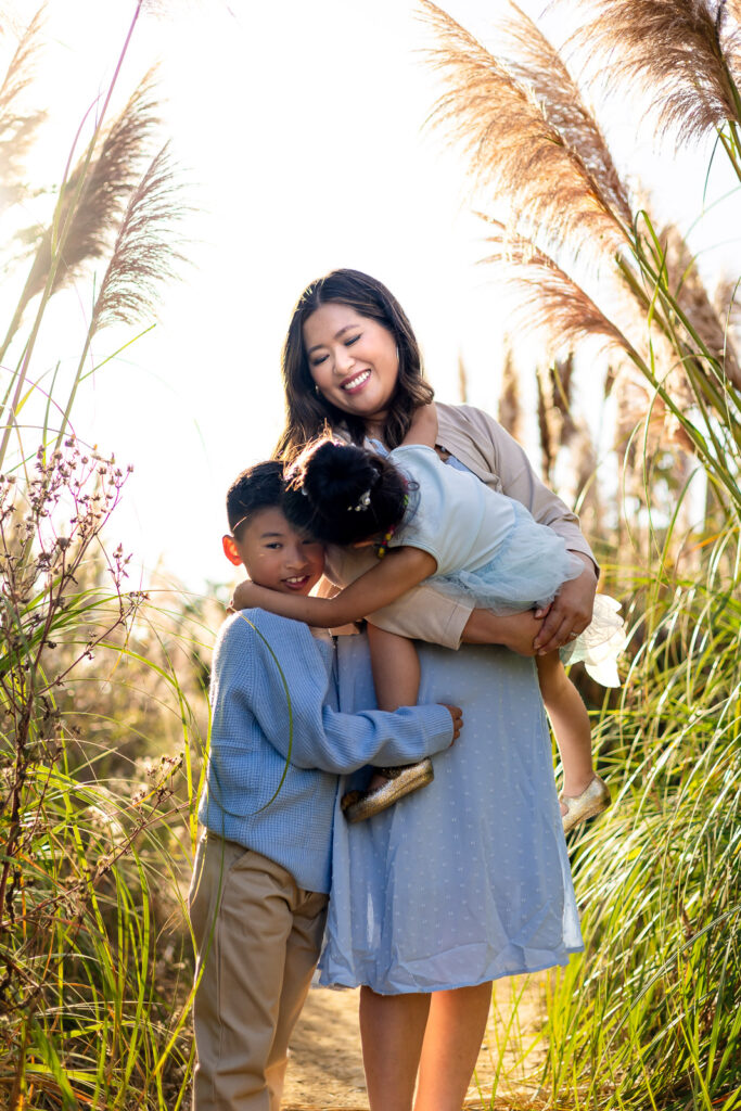Mother with her children during a relaxed outdoor family session