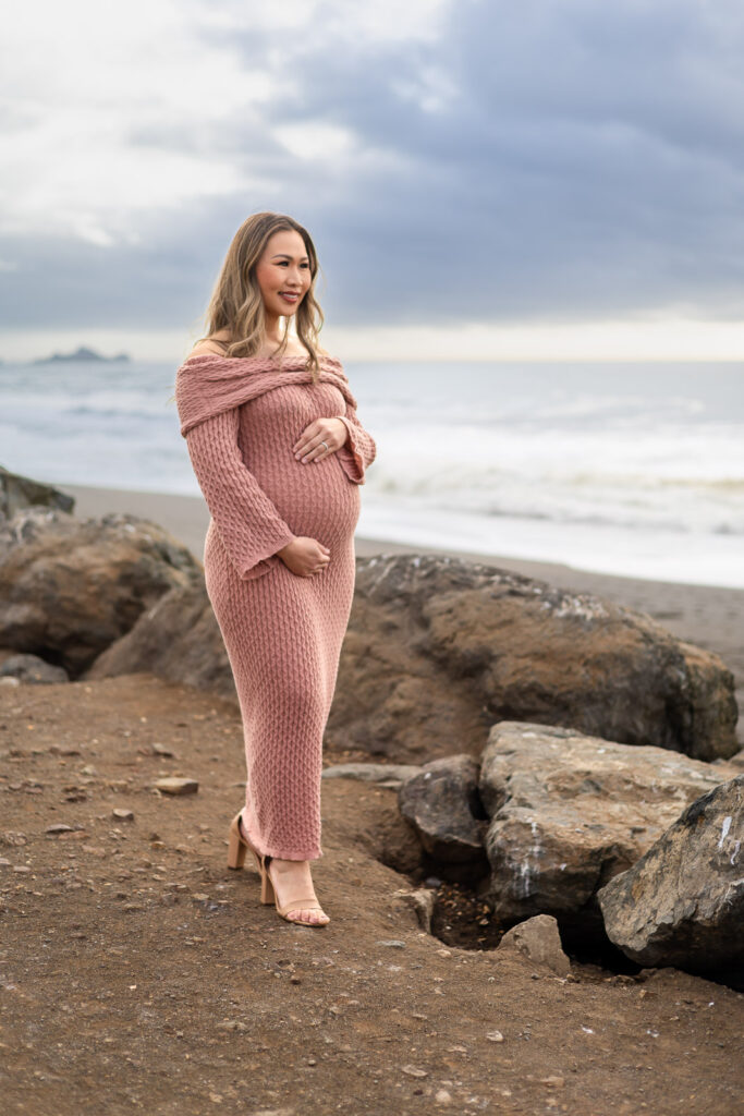 Couple enjoying a maternity session overlooking the Pacific Ocean in Pacifica.
