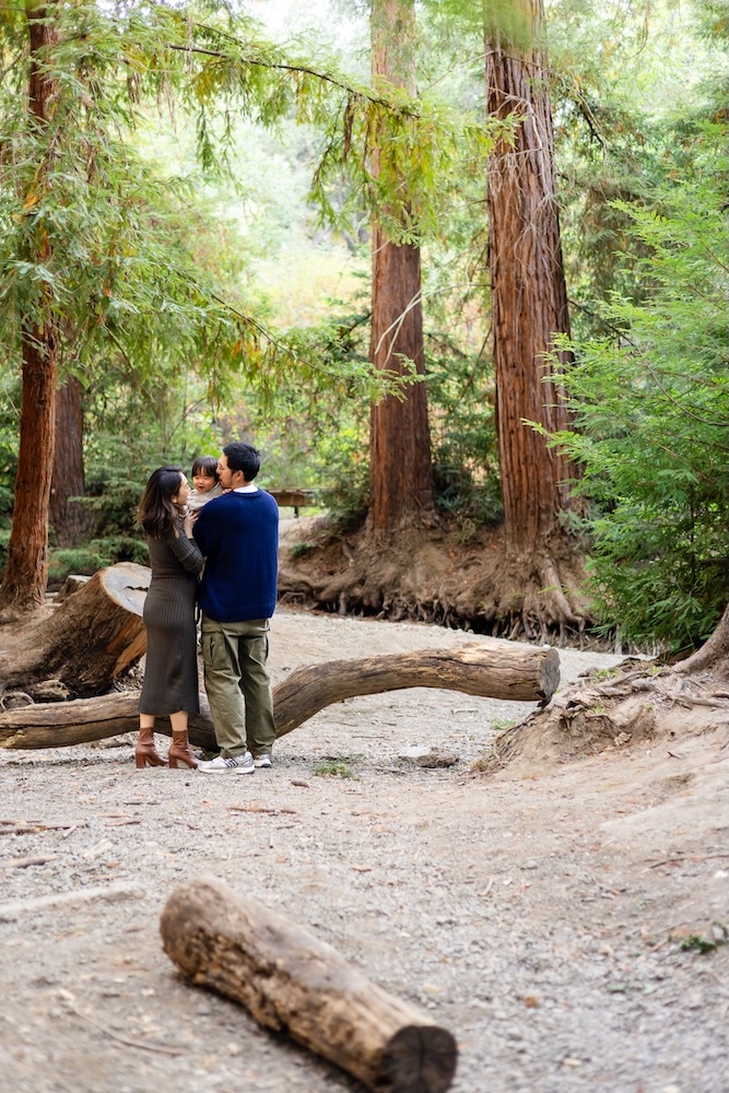 Family enjoying outdoor fall family photos among the redwood trees in Los Altos.